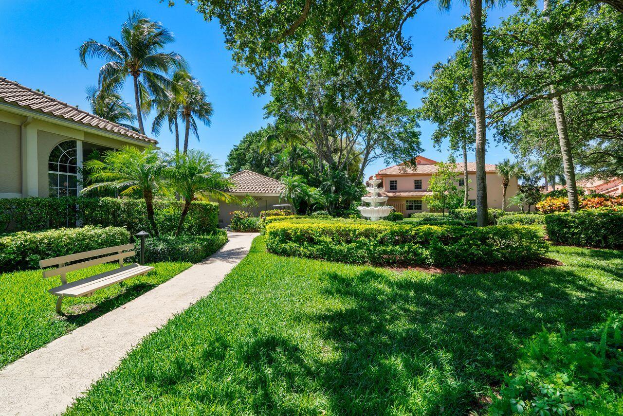 17270 Boca Club Boulevard, Unit 1707 Boca Raton, FL 33487 - Photo 57 of 68 a view of a garden with a house