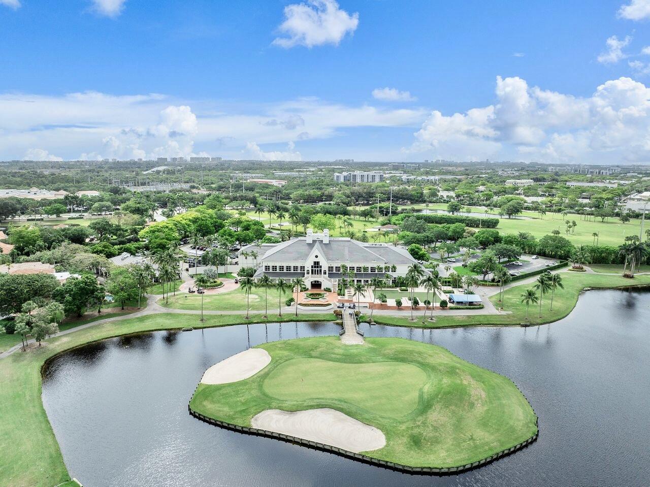 17270 Boca Club Boulevard, Unit 1707 Boca Raton, FL 33487 - Photo 62 of 68 a view of a lake with a mountain in the background