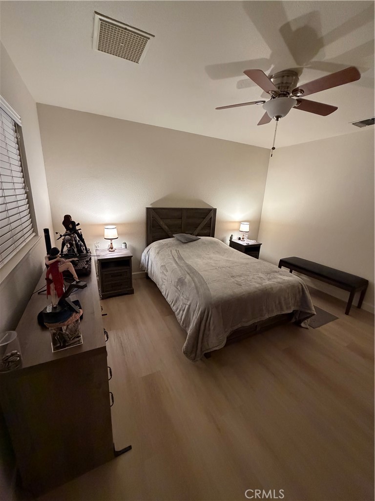 209 Kimberly Lane Ridgecrest, CA 93555 - Photo 28 of 62 a bedroom with bed and a ceiling fan