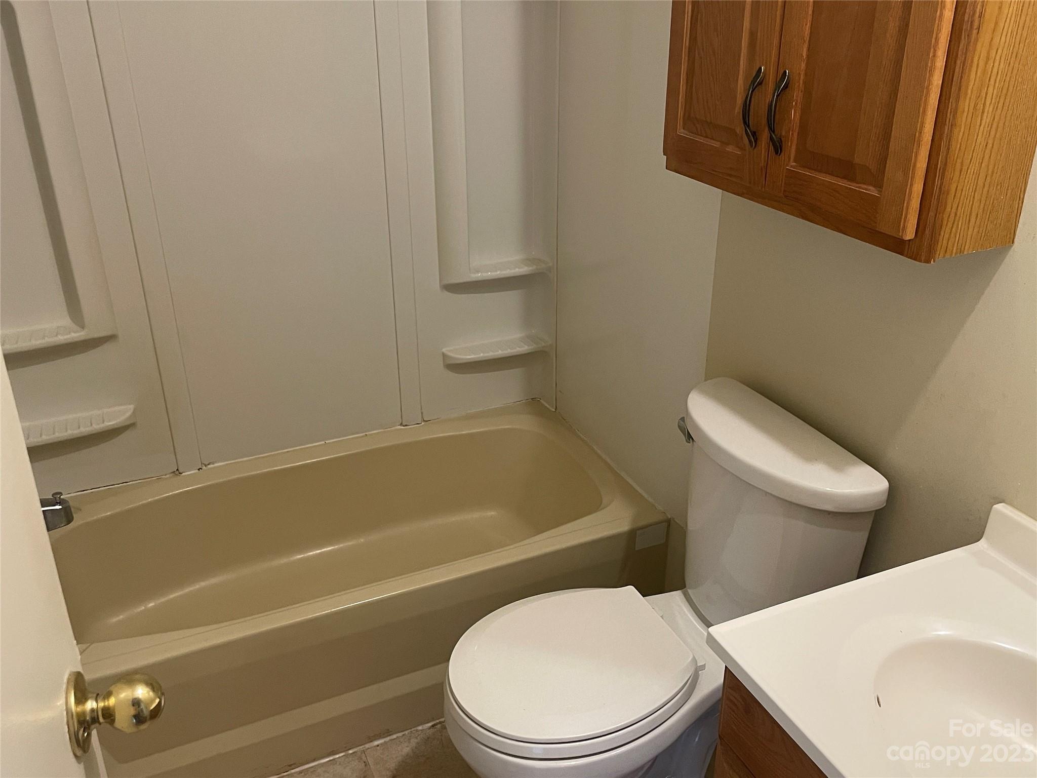 3850 Winter Road Rock Hill, SC 29730 - Photo 12 of 20 a white toilet and tub sitting next to a window