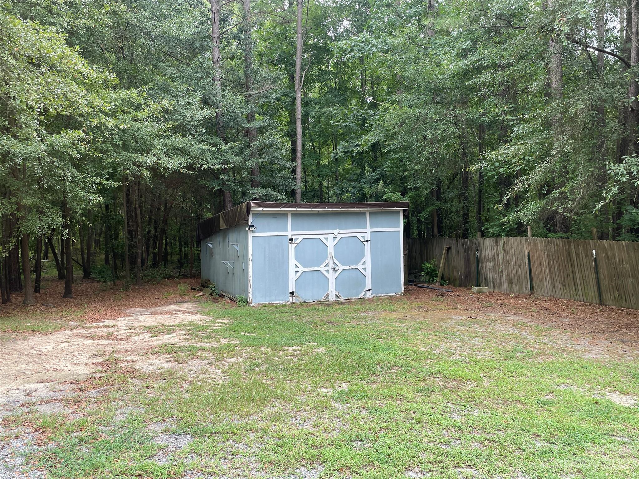 3850 Winter Road Rock Hill, SC 29730 - Photo 18 of 20 a view of a barn in the middle of a yard