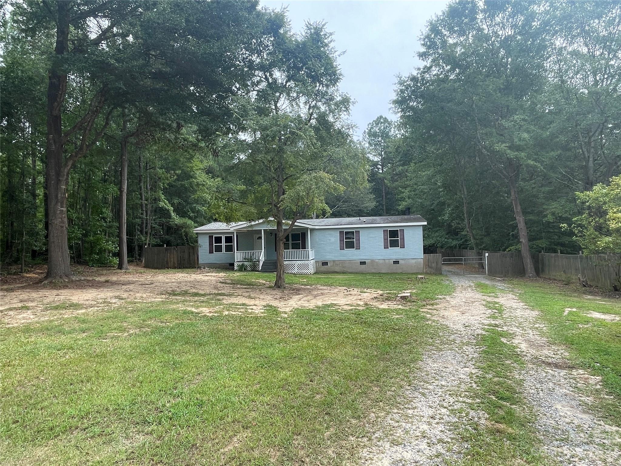 3850 Winter Road Rock Hill, SC 29730 - Photo 2 of 20 a front view of a house with a garden