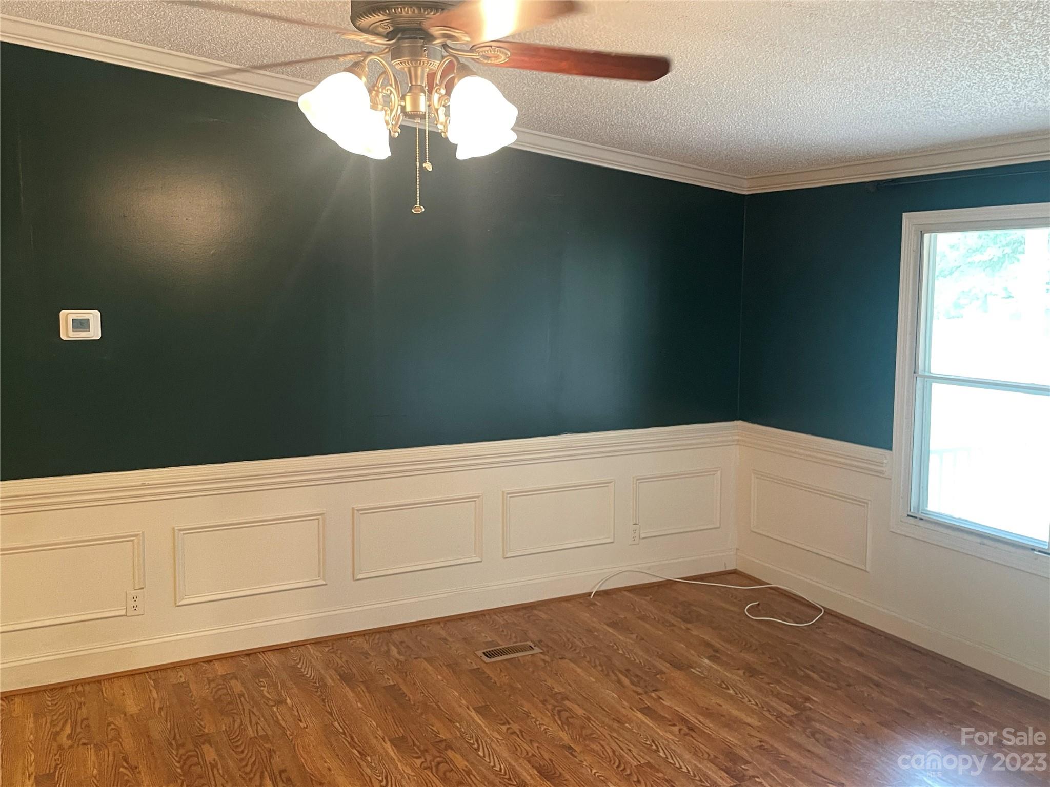 3850 Winter Road Rock Hill, SC 29730 - Photo 4 of 20 a view of an empty room with wooden floor and a window