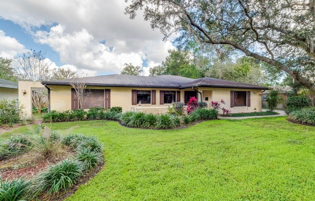 1965 Hunterfield Road Maitland, FL 32751 - Photo 1 of 1 a front view of house with yard and green space