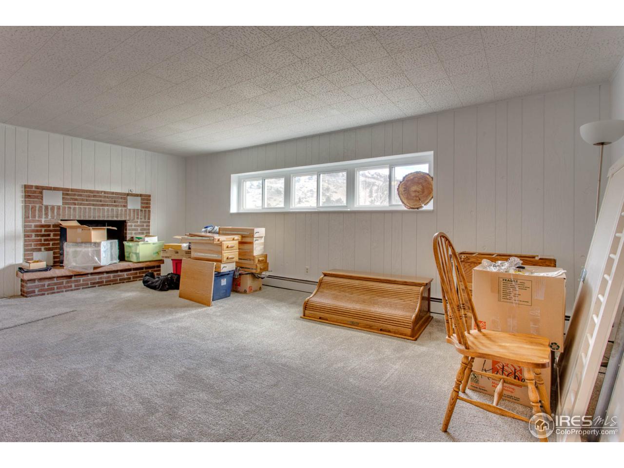 6137 Olde Stage Road Boulder, CO 80302 - Photo 19 of 27 Big Family room w/ Views & Fireplace Lower level