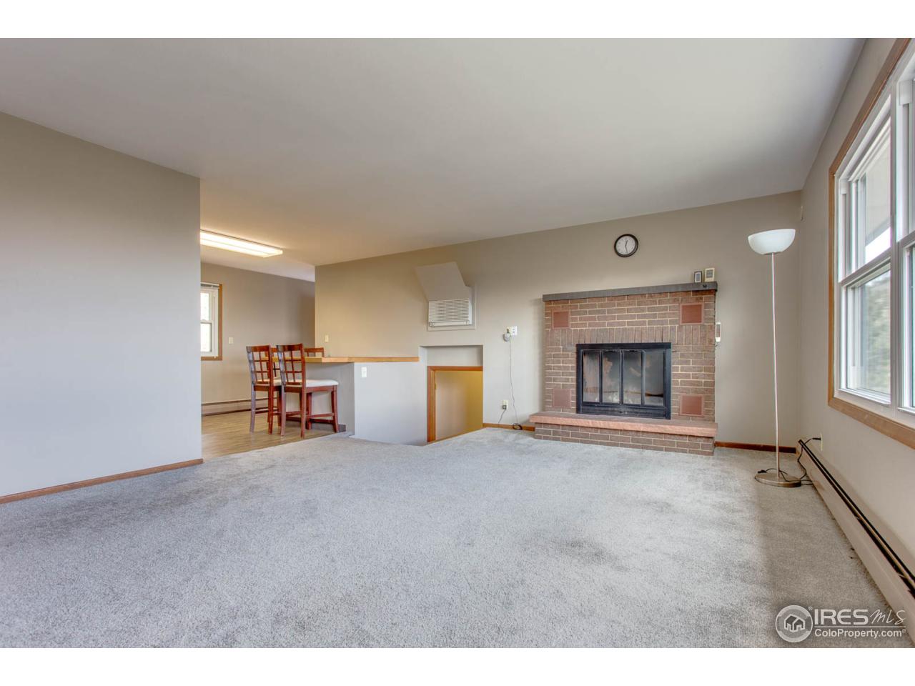 6137 Olde Stage Road Boulder, CO 80302 - Photo 8 of 27 Bright living room, w/ real wood fireplace