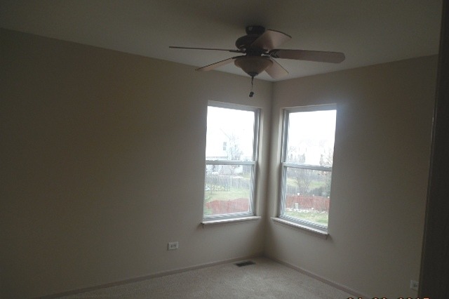 152 Sedgewicke Drive Romeoville, IL 60446 - Photo 11 of 16 a view of an empty room and window