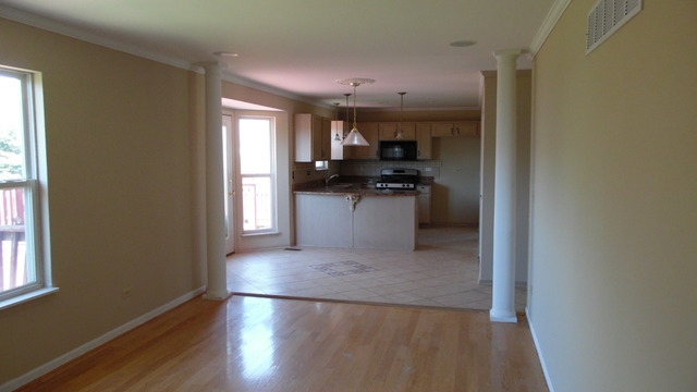 152 Sedgewicke Drive Romeoville, IL 60446 - Photo 9 of 16 a view of a kitchen with a sink stove and refrigerator