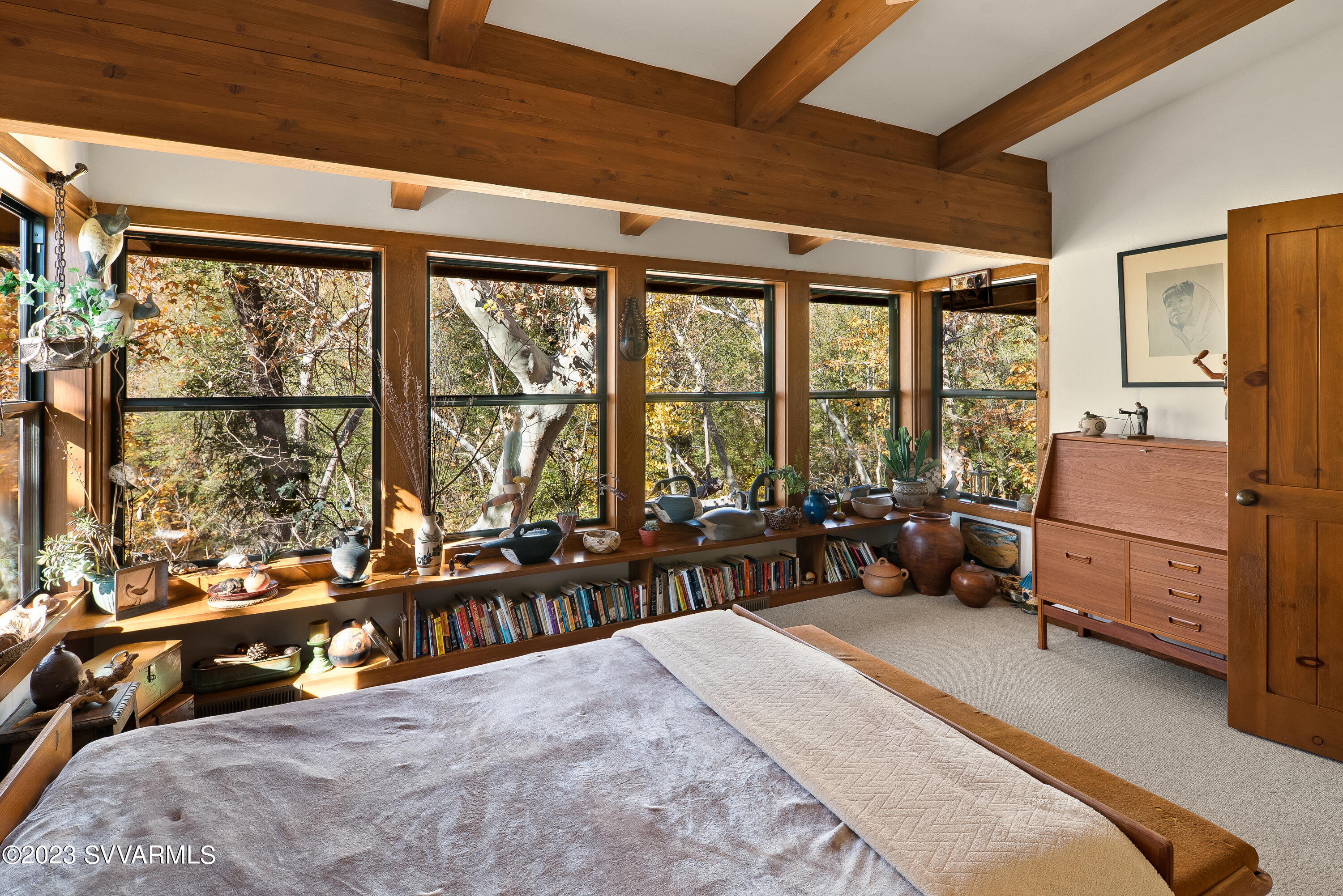 45 Copper Cliffs Lane Sedona, AZ 86336 - Photo 11 of 39 a bedroom with furniture and large windows