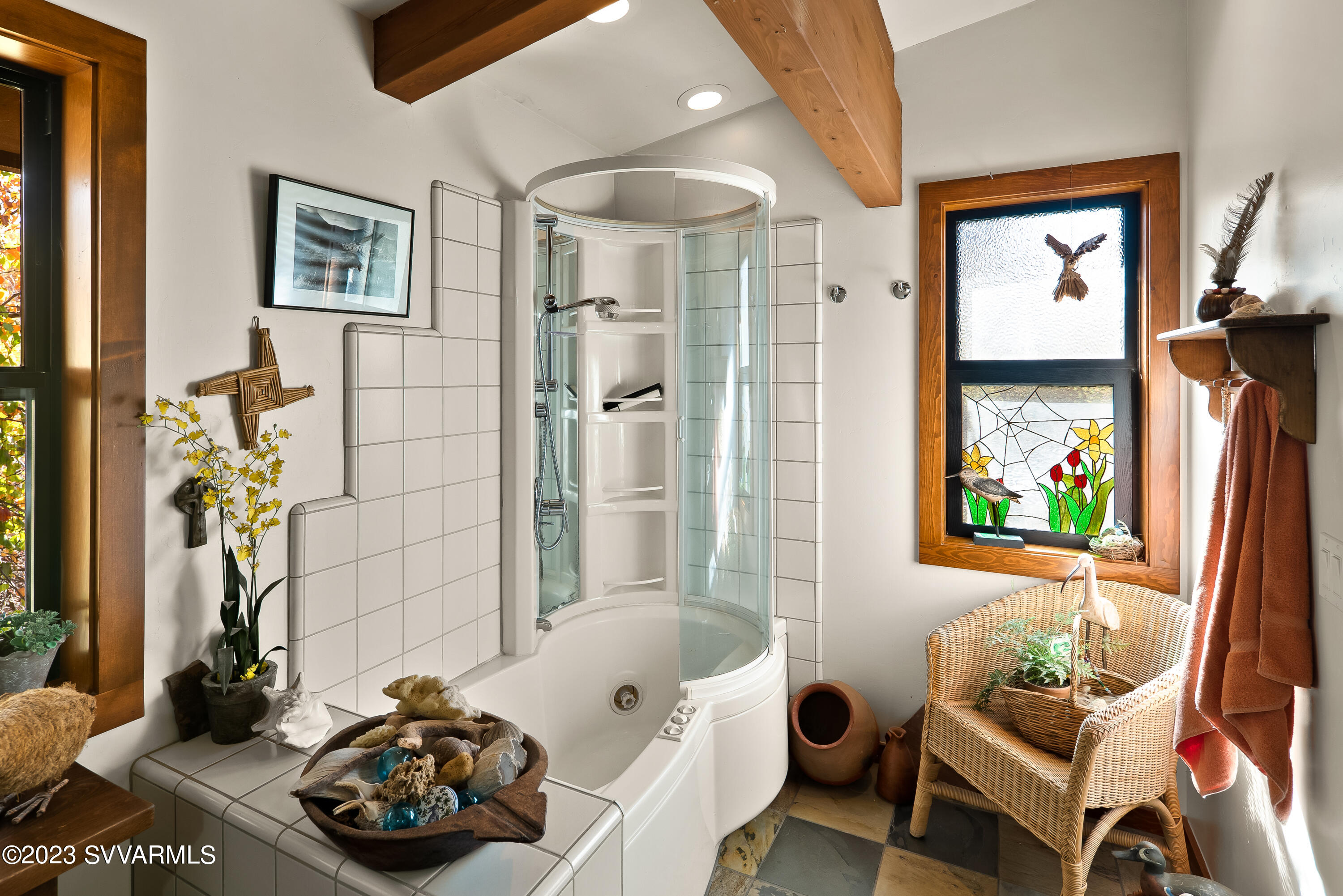 45 Copper Cliffs Lane Sedona, AZ 86336 - Photo 12 of 39 a bathroom with a tub and a window