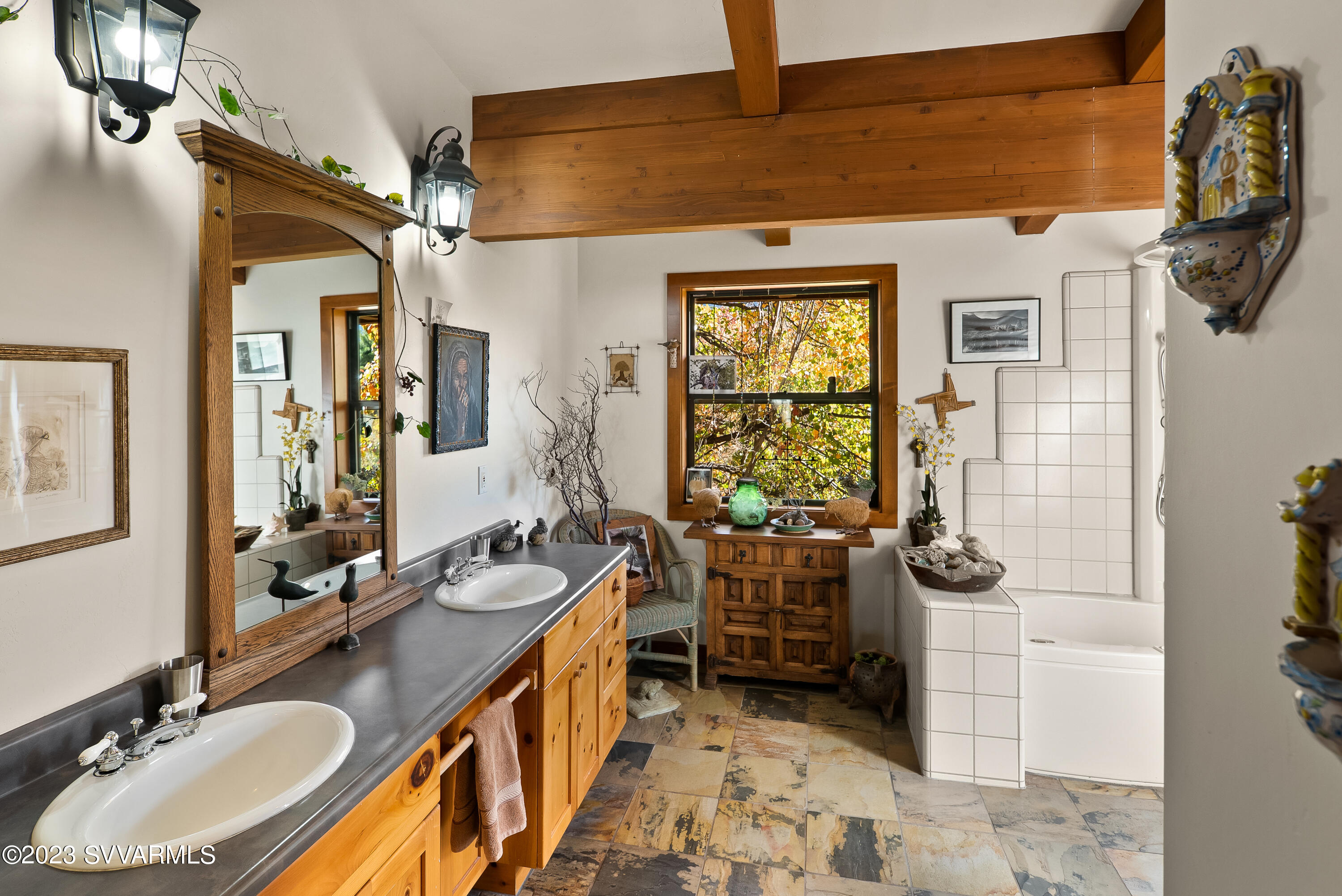 45 Copper Cliffs Lane Sedona, AZ 86336 - Photo 13 of 39 a bathroom with double vanity and a mirror