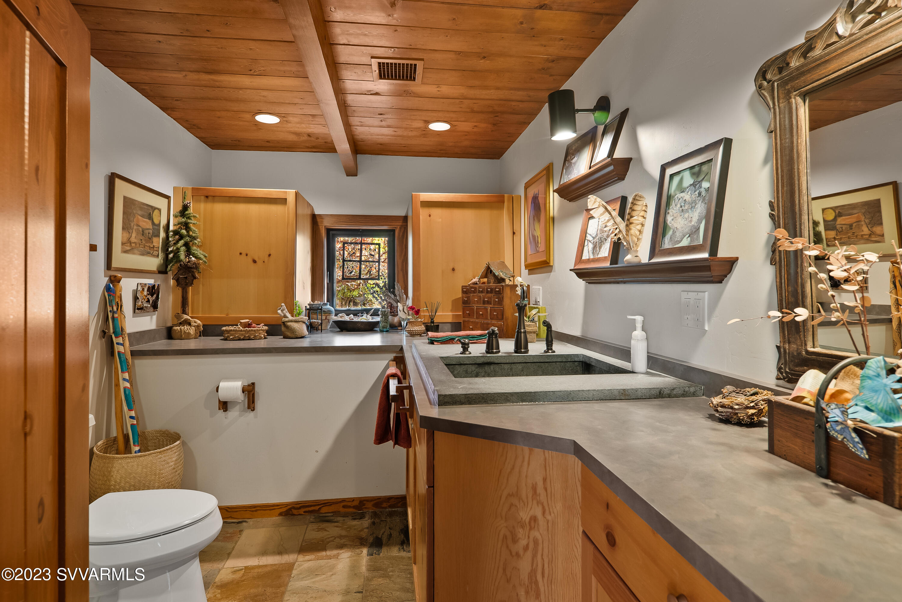 45 Copper Cliffs Lane Sedona, AZ 86336 - Photo 21 of 39 a kitchen with a sink stove and cabinets