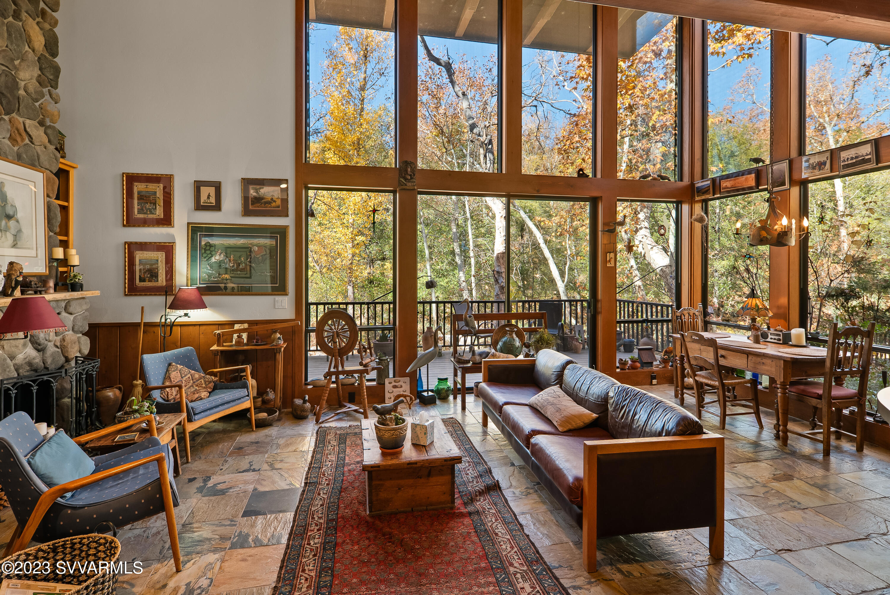 45 Copper Cliffs Lane Sedona, AZ 86336 - Photo 24 of 39 a living room with furniture city view and large windows