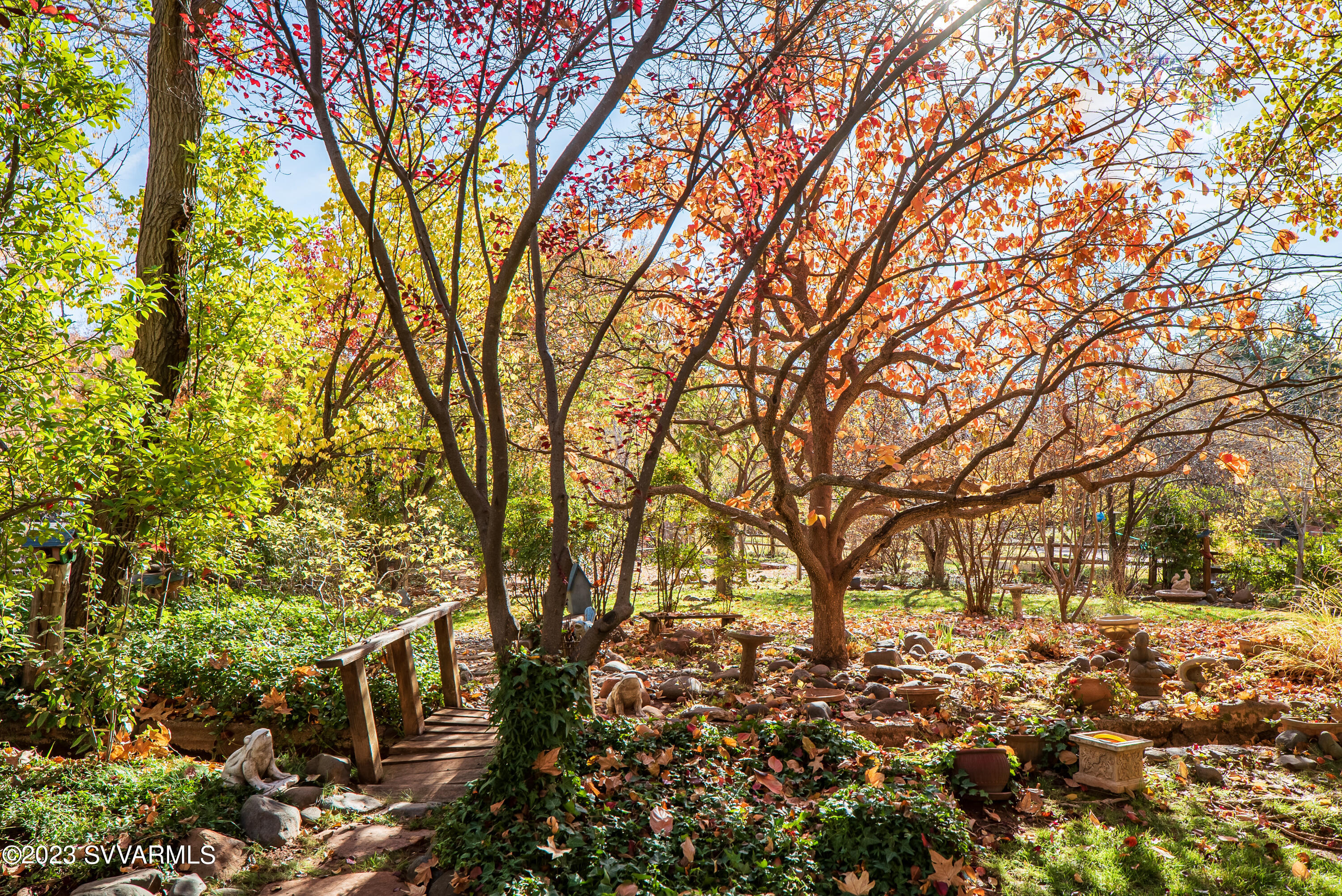 45 Copper Cliffs Lane Sedona, AZ 86336 - Photo 31 of 39 a backyard of a house with lots of green space