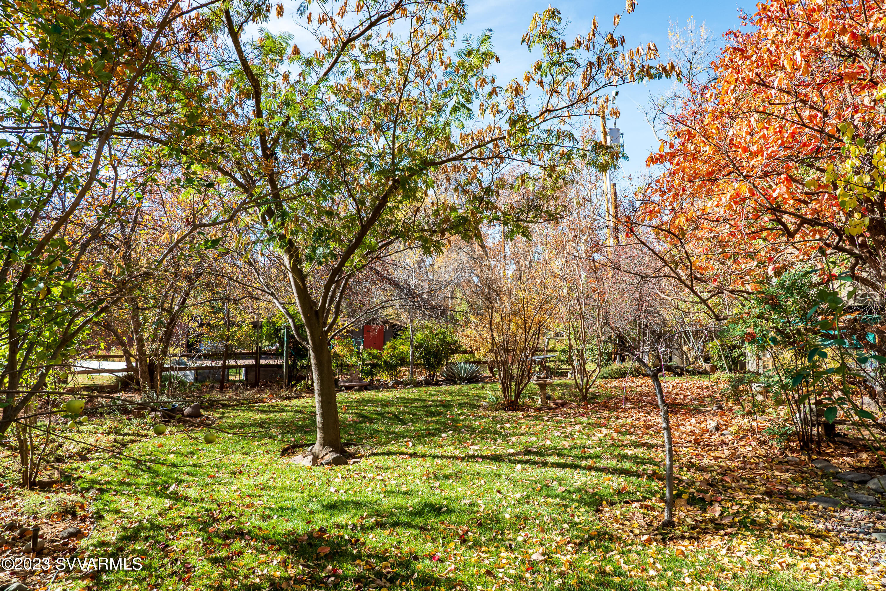 45 Copper Cliffs Lane Sedona, AZ 86336 - Photo 33 of 39 a backyard of a house with lots of green space