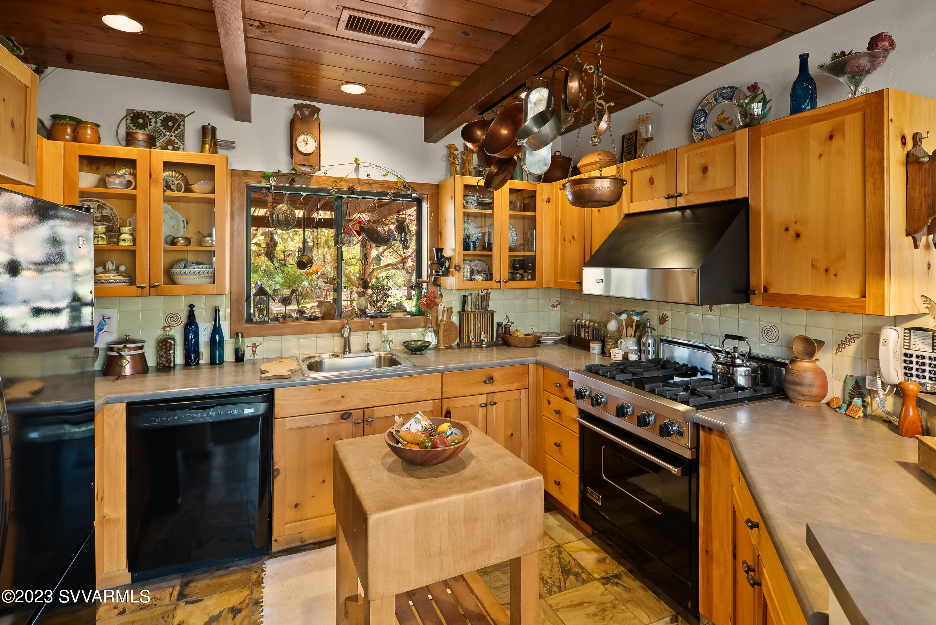 45 Copper Cliffs Lane Sedona, AZ 86336 - Photo 5 of 39 a kitchen with a stove a sink and a refrigerator