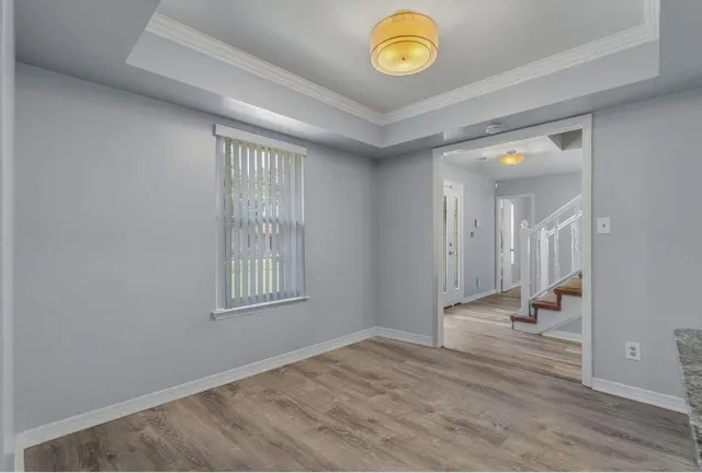 a view of an empty room and a window