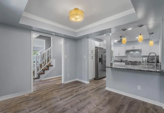 a view of a kitchen cabinets and wooden floor