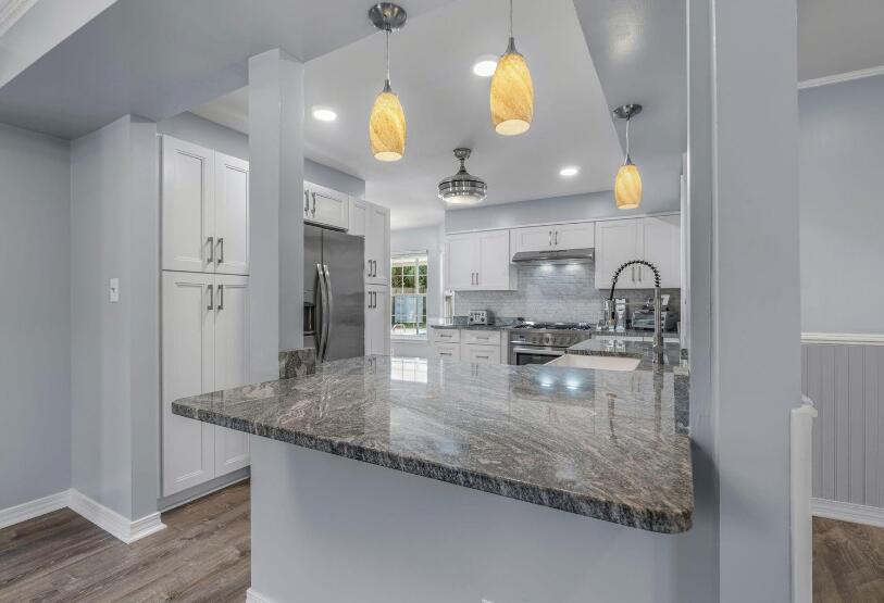 14 Winfield Way Mary Esther, FL 32569 - Photo 16 of 46 a kitchen with granite countertop a sink a counter top space and cabinets