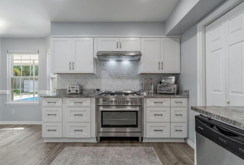 14 Winfield Way Mary Esther, FL 32569 - Photo 18 of 46 a kitchen with stainless steel appliances granite countertop a stove and a sink