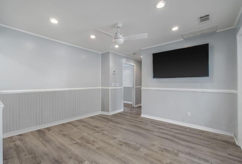 14 Winfield Way Mary Esther, FL 32569 - Photo 21 of 46 an empty room with wooden floor and windows