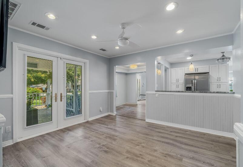 14 Winfield Way Mary Esther, FL 32569 - Photo 22 of 46 a view of an empty room with wooden floor and a window
