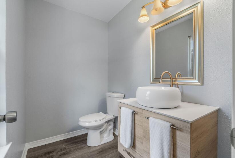 14 Winfield Way Mary Esther, FL 32569 - Photo 24 of 46 a bathroom with a toilet sink and mirror