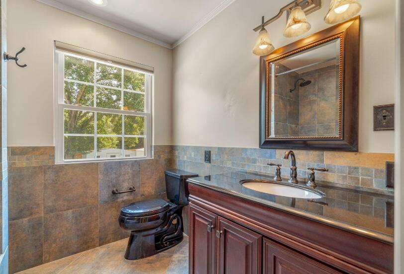 14 Winfield Way Mary Esther, FL 32569 - Photo 26 of 46 a bathroom with a sink a toilet and a mirror