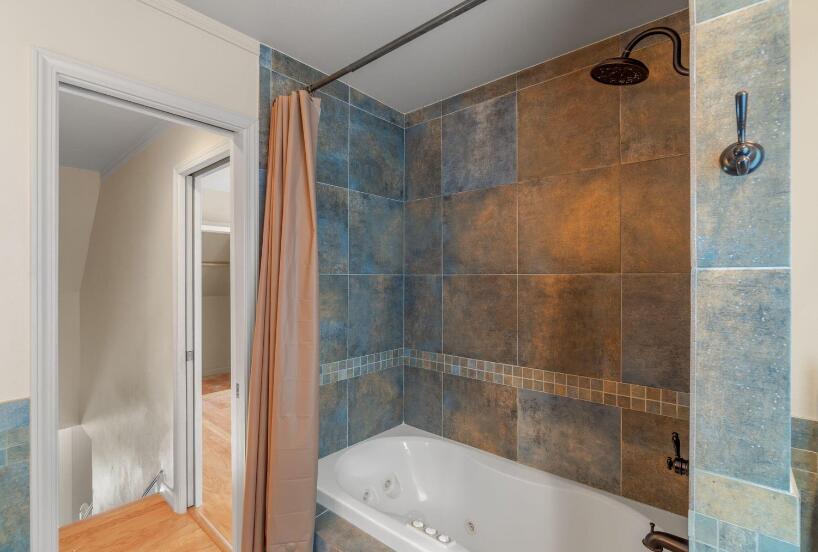 14 Winfield Way Mary Esther, FL 32569 - Photo 27 of 46 a bathroom with a bathtub and a shower