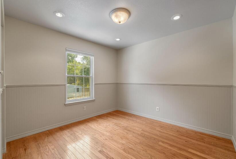 14 Winfield Way Mary Esther, FL 32569 - Photo 28 of 46 an empty room with wooden floor and windows
