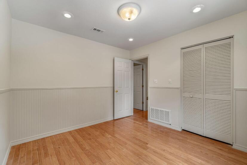 14 Winfield Way Mary Esther, FL 32569 - Photo 29 of 46 an empty room with wooden floor and windows