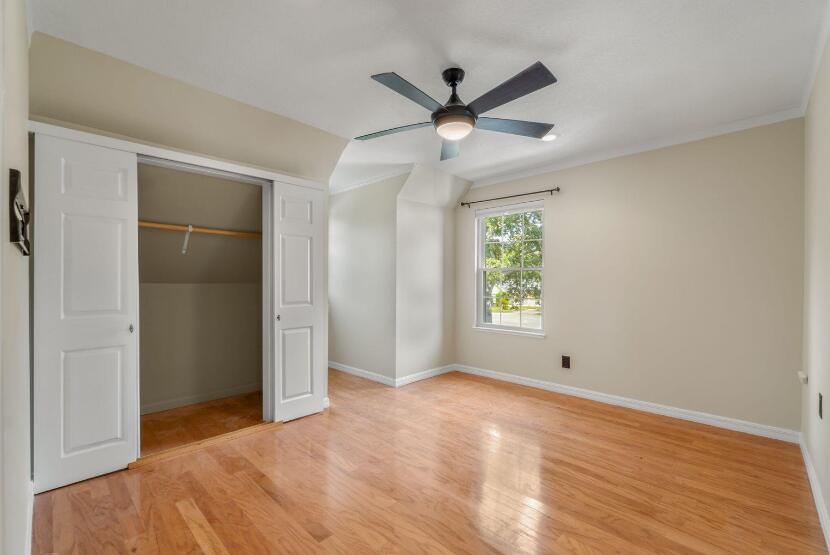 14 Winfield Way Mary Esther, FL 32569 - Photo 33 of 46 a view of an empty room with wooden floor and a window
