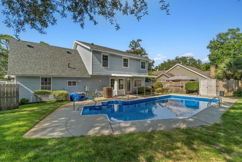 14 Winfield Way Mary Esther, FL 32569 - Photo 43 of 46 a view of house with outdoor space and swimming pool