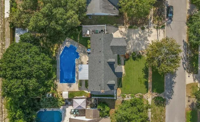 an aerial view of multiple houses with outdoor space