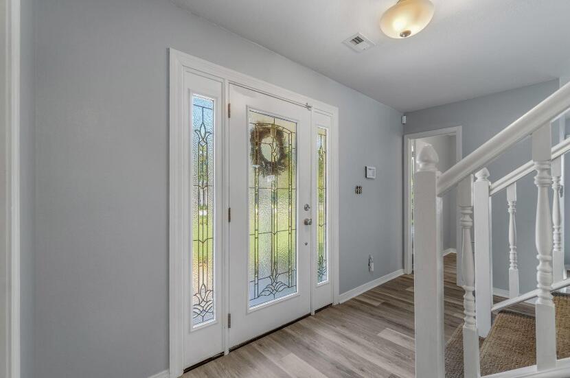14 Winfield Way Mary Esther, FL 32569 - Photo 9 of 46 a view of an entryway with wooden floor