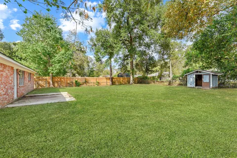 a view of a house with a big yard