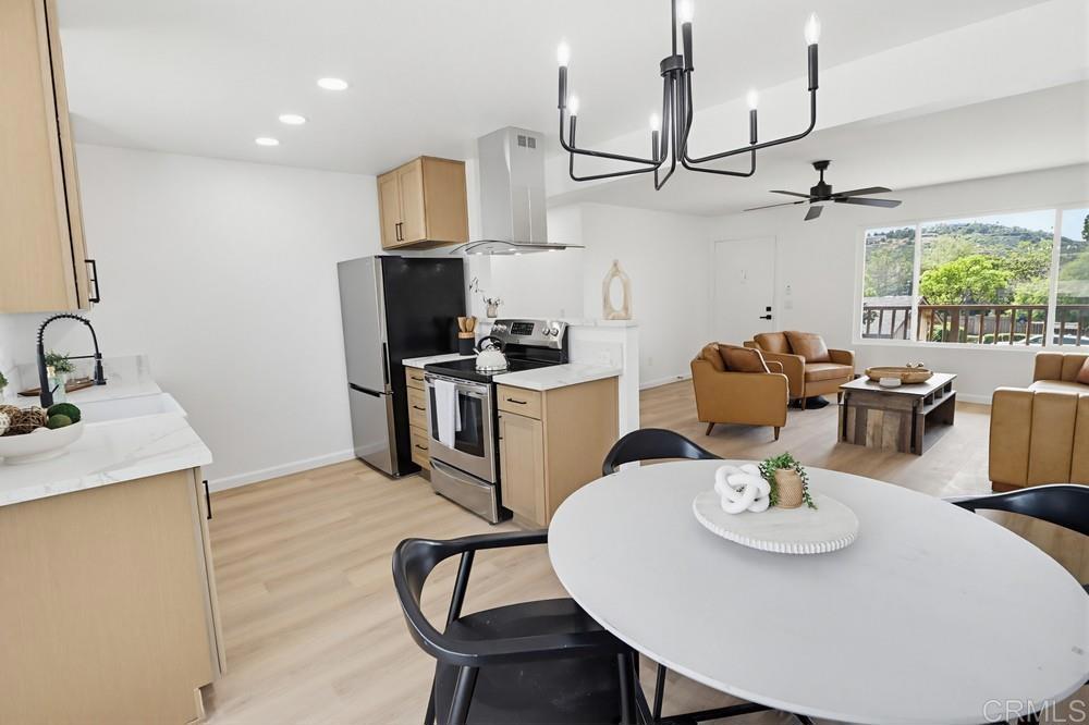 895 Jamacha Road El Cajon, CA 92019 - Photo 11 of 33 a kitchen with a table chairs stove and refrigerator