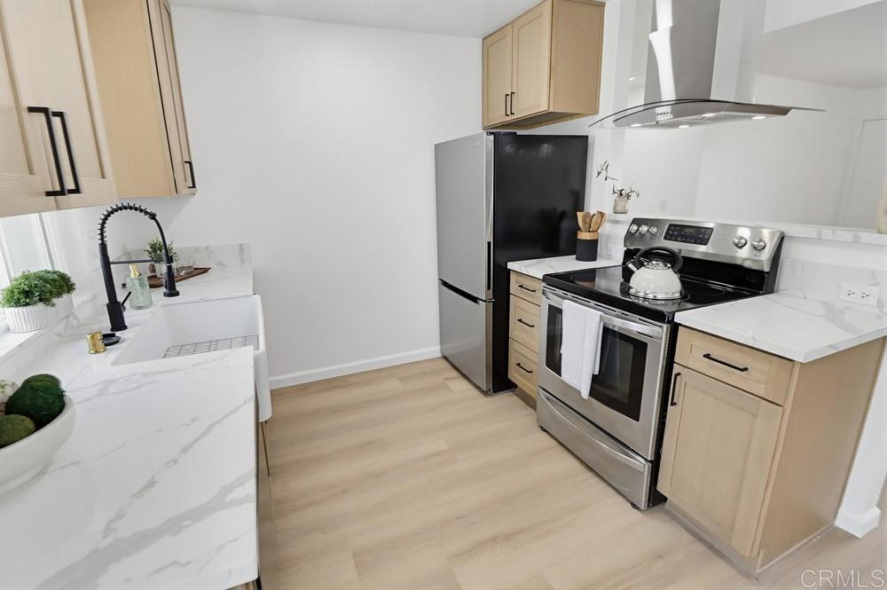 895 Jamacha Road El Cajon, CA 92019 - Photo 12 of 33 a kitchen with granite countertop a sink stove and refrigerator