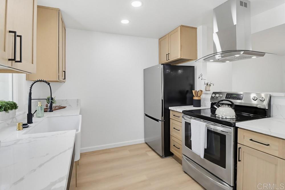 895 Jamacha Road El Cajon, CA 92019 - Photo 14 of 33 a kitchen with stainless steel appliances granite countertop a sink stove and refrigerator