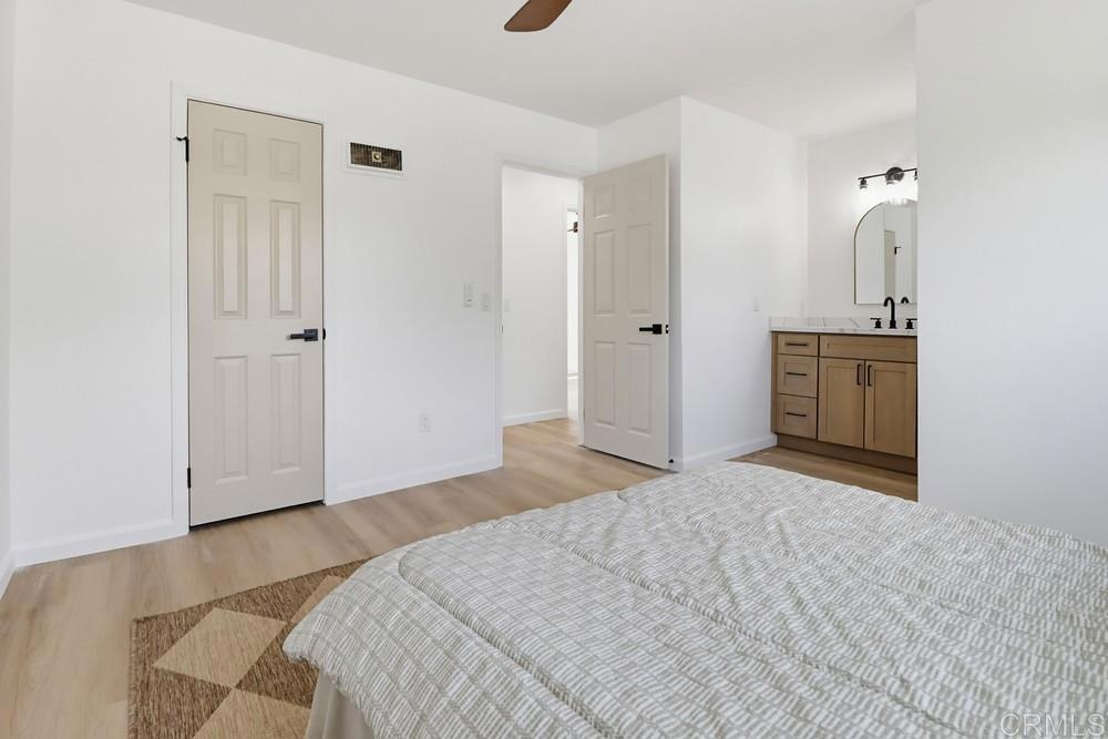 895 Jamacha Road El Cajon, CA 92019 - Photo 19 of 33 a bedroom with a bed and a dresser