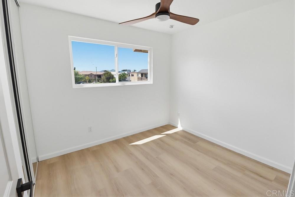 895 Jamacha Road El Cajon, CA 92019 - Photo 25 of 33 an empty room with a window and a ceiling fan