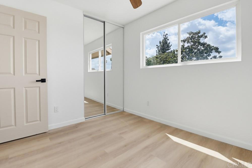 895 Jamacha Road El Cajon, CA 92019 - Photo 26 of 33 an empty room with wooden floor and window