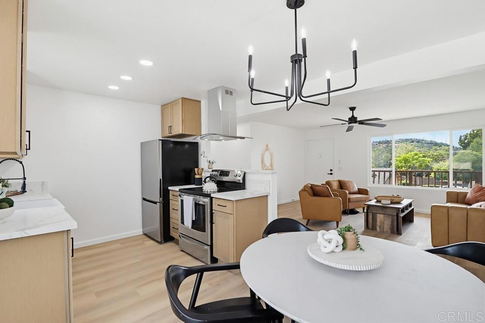 895 Jamacha Road El Cajon, CA 92019 - Photo 10 of 33 a kitchen with a table chairs stove and microwave