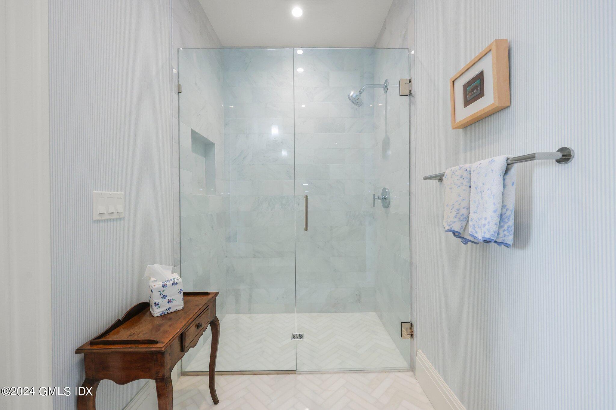 62 Mason Street, Unit PHW Greenwich, CT 06830 - Photo 15 of 18 a bathroom with a bathtub and shower