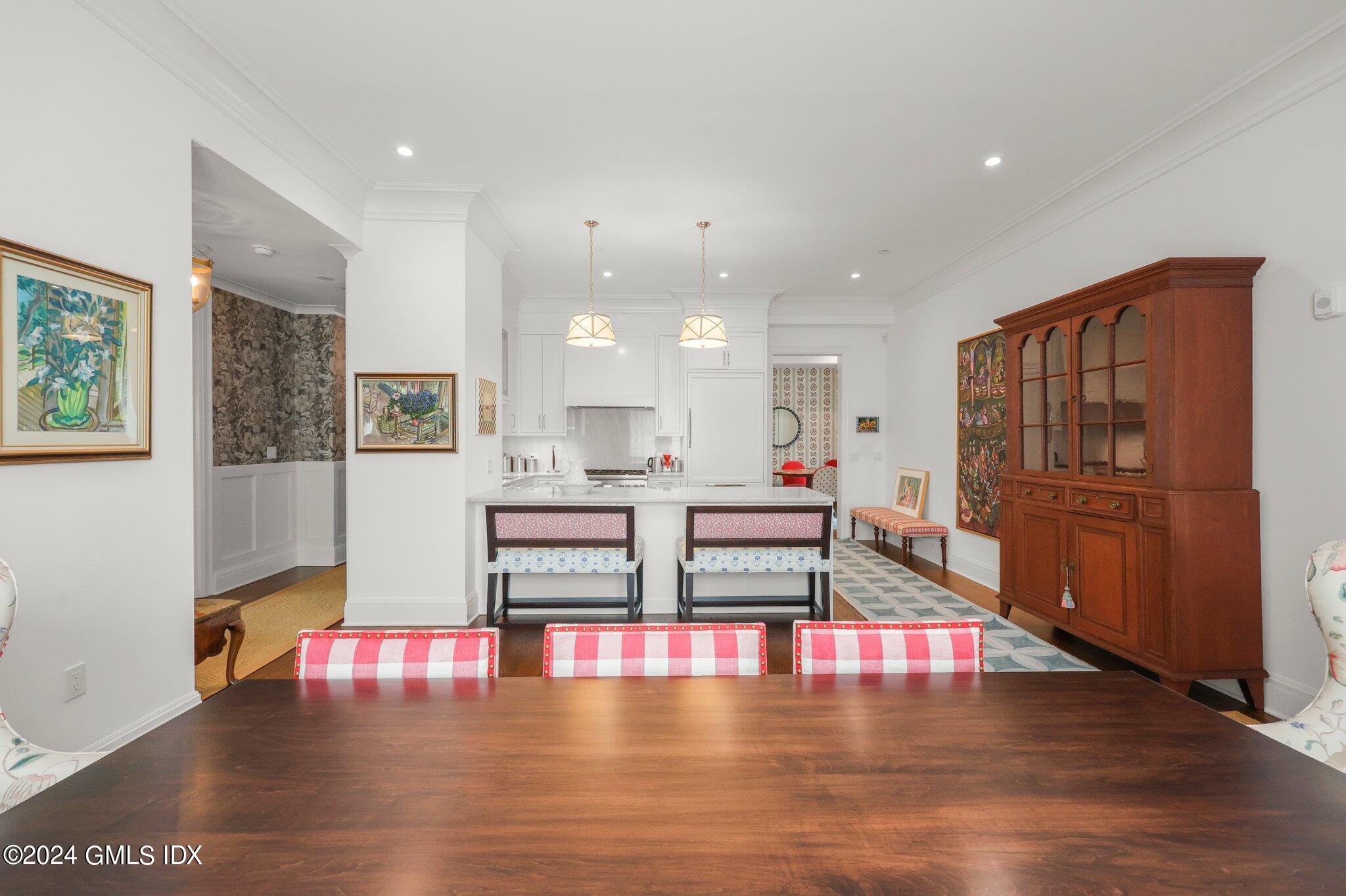 62 Mason Street, Unit PHW Greenwich, CT 06830 - Photo 10 of 18 a living room with furniture wooden floor and a table
