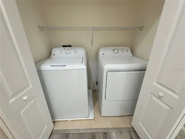 a utility room with dryer and washer