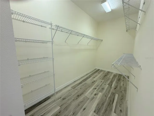 a view of a room with racks on the wall