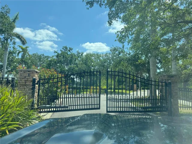 a view of a gate and fence