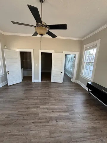 a bathroom with a granite countertop sink a toilet and bathtub