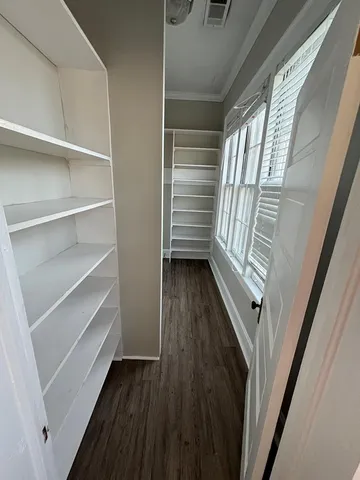 a bathroom with a toilet and a vanity